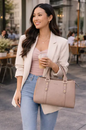Gen Z woman carrying the Emlonc Fortelle Large Tote in beige vegan leather, styled in a relaxed daytime café setting with a modern city lifestyle
