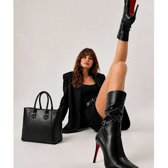 Handcrafted black premium vegan leather large tote bag styled in high fashion editorial photoshoot